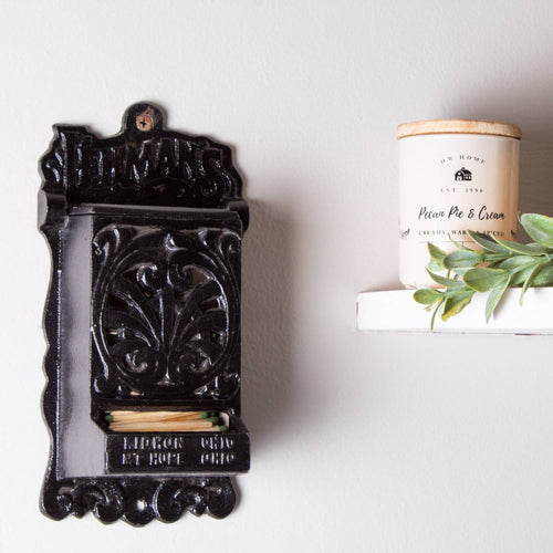 Handcrafted black cast iron wall-mounted matchbox holder with ornate vintage design and Lehman's branding, Amish made in USA, ideal for Home & Decor, Household Helpers, and Best Sellers collections.