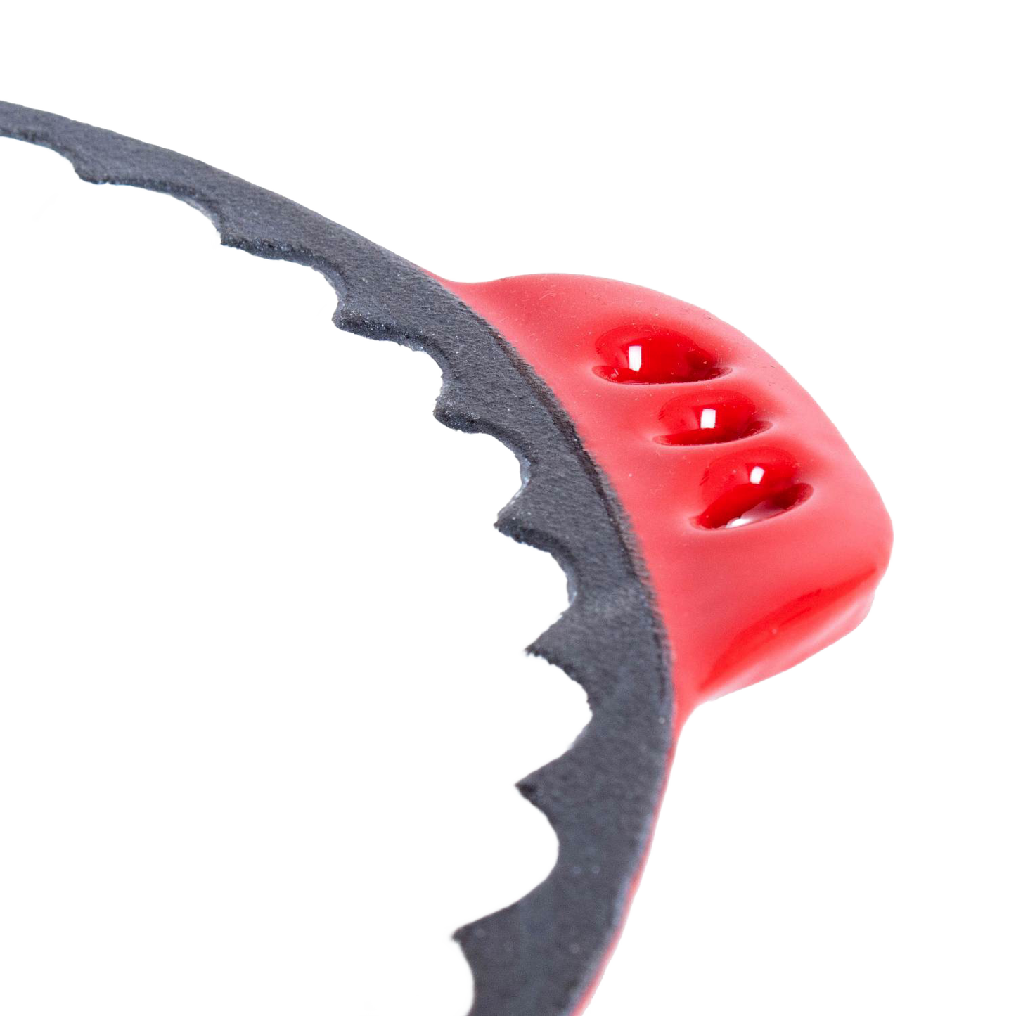 Close-up of a handcrafted cast iron pie pan edge with decorative crimps and a red handle detail, highlighting durable construction for Kitchen & Food, Cookware, and Baking Supplies collections.
