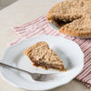 Slice of handcrafted shoofly pie with crumb topping on white plate with fork, whole pie on red and white striped cloth, ideal for Kitchen & Food, Snacks and Sweets, USA Made, Best Sellers collections.