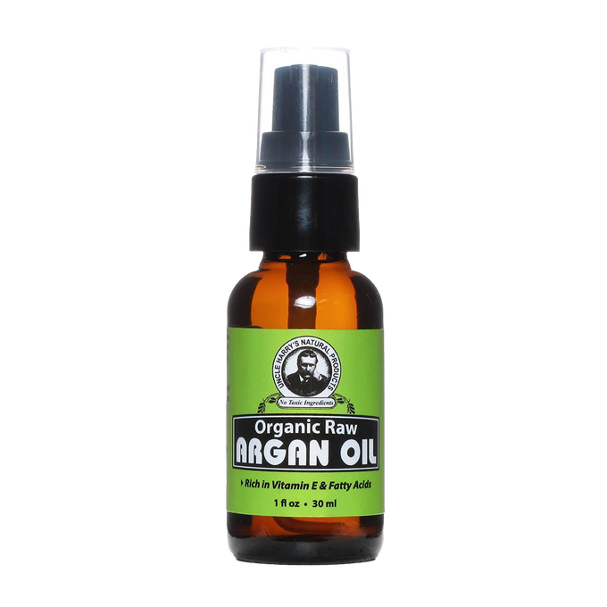 Handcrafted amber glass bottle of organic raw argan oil with black pump and clear cap, rich in vitamin E and fatty acids, part of Health & Wellness, Grooming and Personal Hygiene, USA Made, and Best Sellers collections.