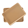 Two gold interior nonstick aluminum half-sheet baking pans stacked, designed for even heating and easy release, perfect for kitchen, cookware, baking supplies, and USA made collections.