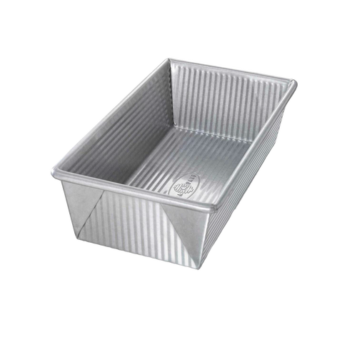 Large nonstick loaf pan made of durable aluminized steel with corrugated texture for warp resistance and even baking, handcrafted and made in USA for Kitchen & Food and Baking Supplies collections.