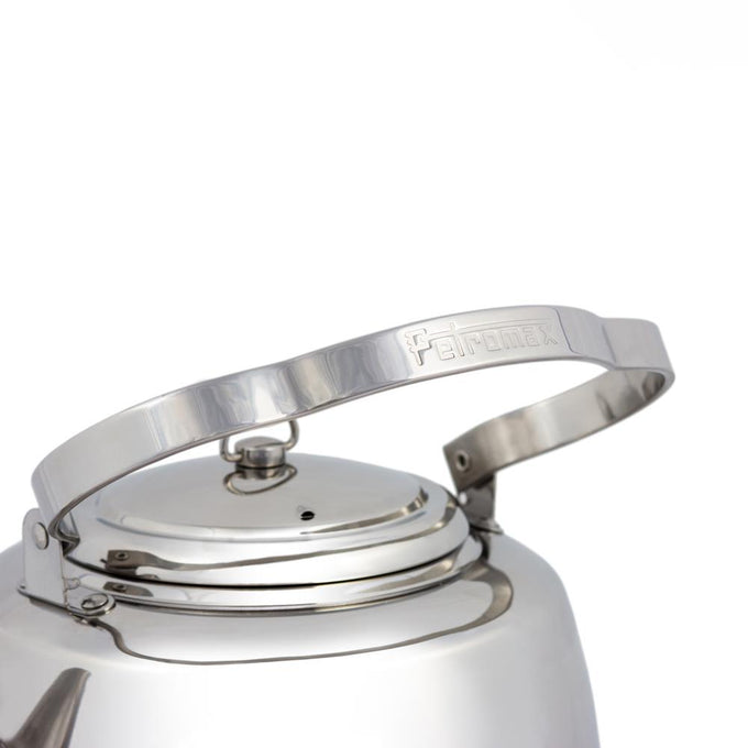Close-up of a polished stainless steel handle with embossed branding on a teakettle, crafted for easy hanging and comfortable use, suited for Farm, Garden & Tool, Kitchen & Food, Camping, Brewing Coffee and Tea, Best Sellers, and Promo Eligible collections.