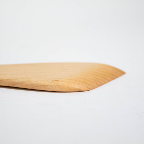 Close-up of a handcrafted solid American Hard Maple wooden spatula with a smooth, polished finish, perfect for Kitchen & Food, Holiday Hosting, Storage and Serving, and USA Made collections.