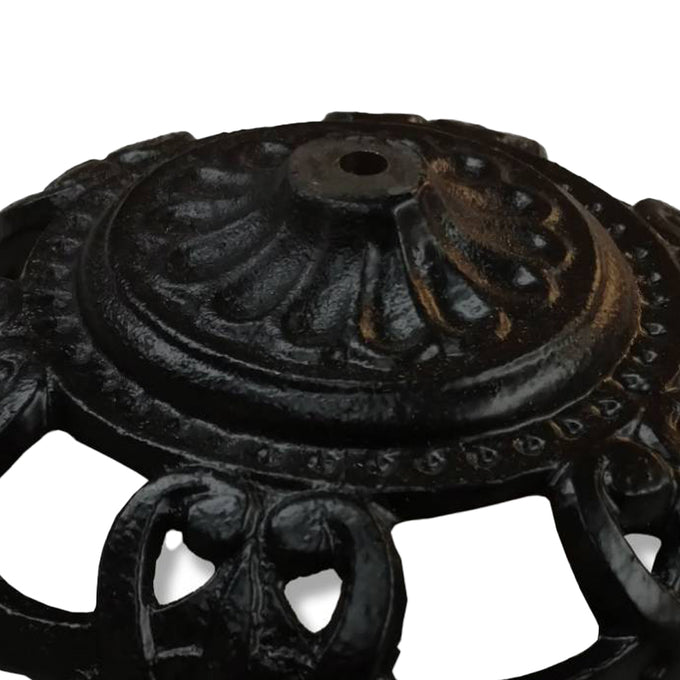 Close-up of a sturdy cast iron bowl with decorative detailing and central hole, handcrafted for lamps and lighting parts, featured in best sellers and promo eligible collections.