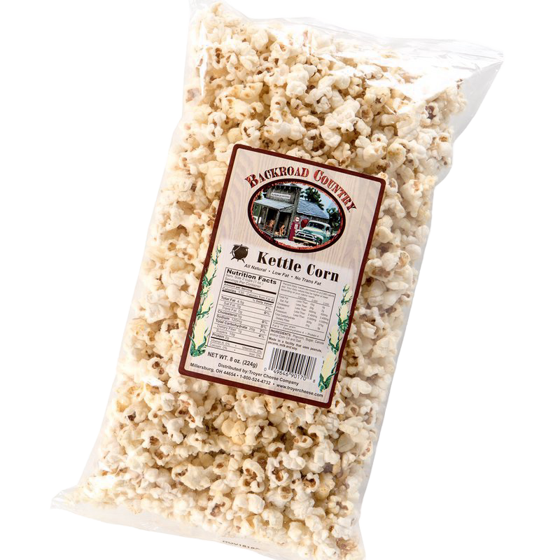Clear plastic bag filled with crunchy, lightly sweetened kettle corn with label showing local country store, handcrafted in USA, featured in Kitchen & Food, Snacks and Sweets, Popcorn, and USA Made collections.