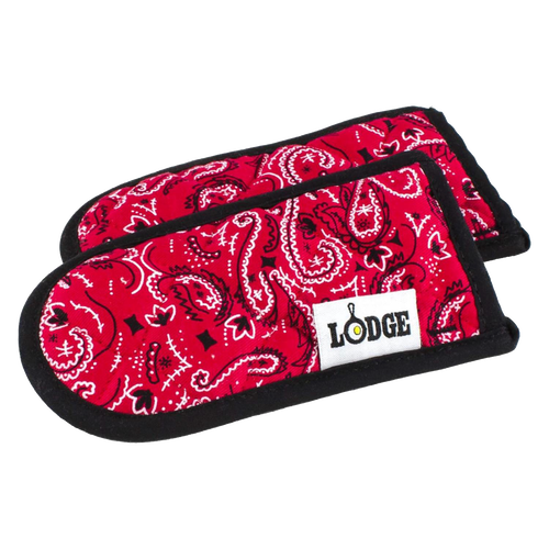 Pair of red paisley-patterned kitchen handle pads with black trim and a Lodge logo tag, designed for cast iron cookware, featured in Kitchen & Food, Cookware, Cast Iron, and Best Sellers collections.