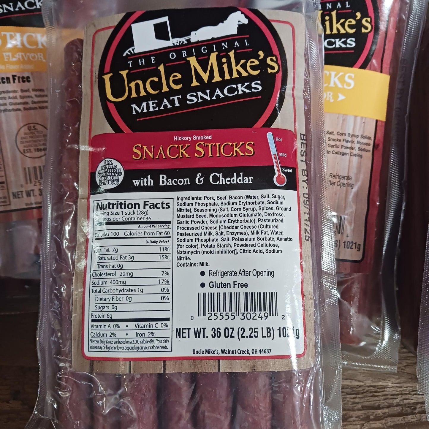 Clear package of handcrafted hickory smoked snack sticks infused with bacon and cheddar flavor, a savory gluten-free meat snack made in USA, ideal for Kitchen & Food, Snacks and Sweets, Meats, USA Made, Best Sellers, Promo Eligible collections.