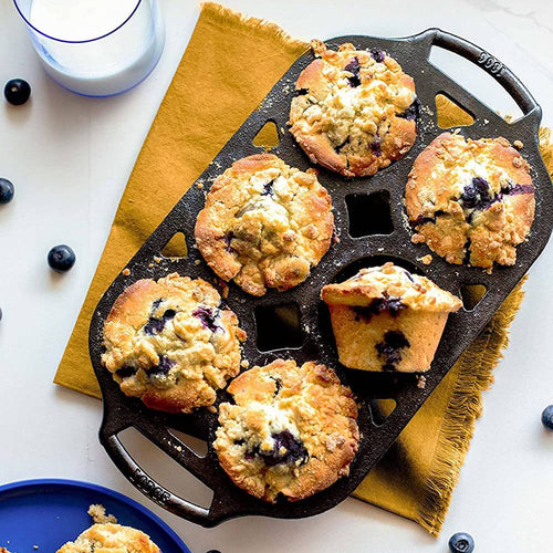 Handcrafted cast iron muffin pan with six golden-brown blueberry muffins, showcasing even baking and browning, perfect for Kitchen & Food, Cookware, Cast Iron, Baking Supplies, USA Made, and Best Sellers collections.