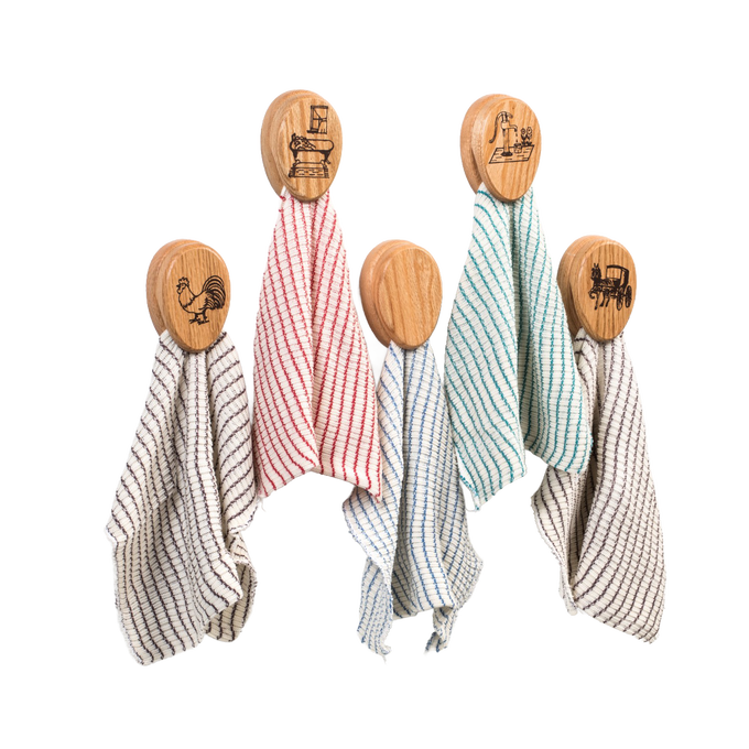 Set of handcrafted oak towel holders with protective clear finish, each featuring unique rustic engravings including a rooster, old sewing machine, water pump, and horse-drawn buggy, ideal for Home & Decor, Household Helpers, USA Made, Amish Made, Best Sellers, and Promo Eligible collections.