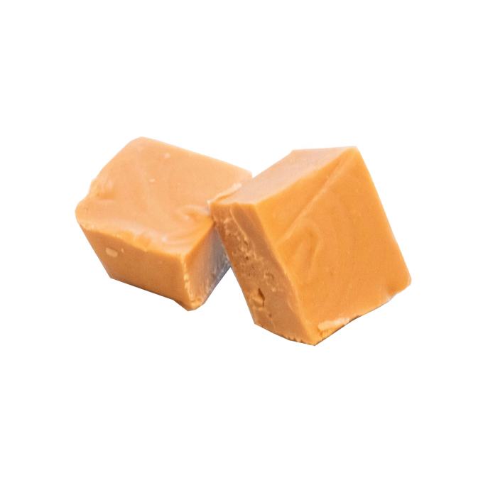Two handcrafted creamy caramel fudge pieces with a smooth, rich texture, featured in Kitchen & Food, Food, Snacks and Sweets, USA Made, Best Sellers, and Promo Eligible collections.