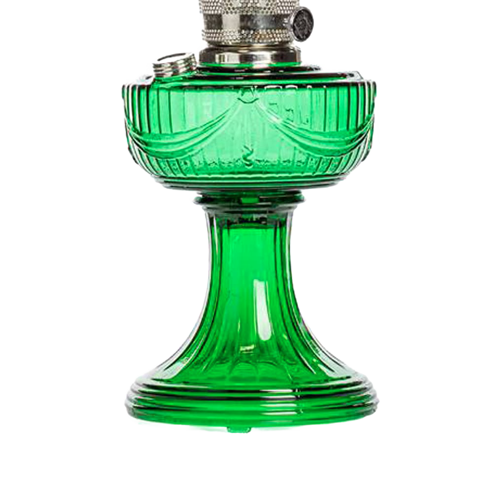 Handcrafted emerald green glass oil lamp with a sweeping drape font and brass trim, offering vintage charm and 10-12 hour burn time, ideal for Lamps & Lighting and Table Lamps collections.