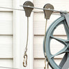 Close-up of metal laundry pulley system with steel cable and hooks attached, designed for outdoor clothesline use in Home & Decor, Laundry Supplies, and USA Made collections.