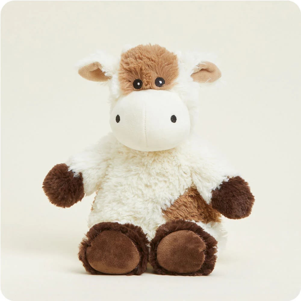 Soft and weighted plush animal resembling a cow, microwaveable and scented with dried lavender, ideal for health remedies, indoor play, and children's toys collections.