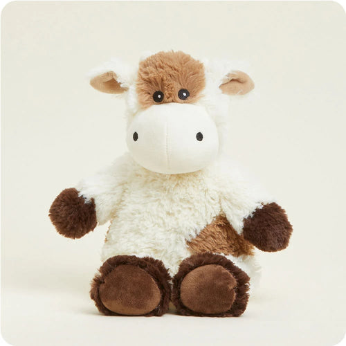 Soft and weighted plush animal resembling a cow, microwaveable and scented with dried lavender, ideal for health remedies, indoor play, and children's toys collections.