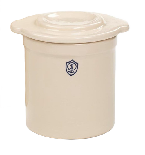 Cream-colored stoneware lid with integrated side handles, crafted in USA, designed to fit numbered and utility crocks for kitchen food preservation, fermenting, and pickling collections.