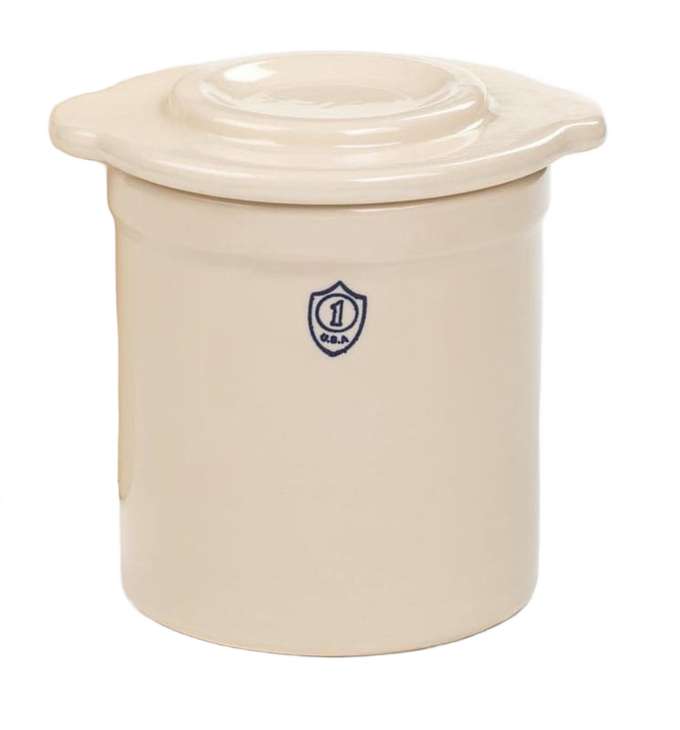 Cream-colored stoneware lid with integrated side handles, crafted in USA, designed to fit numbered and utility crocks for kitchen food preservation, fermenting, and pickling collections.