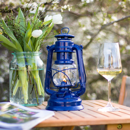 Handcrafted blue galvanized oil lantern with thermal heat-resistant SUPRAX globe, providing steady light for camping, emergency supplies, and outdoor settings in lamps & lighting collections.