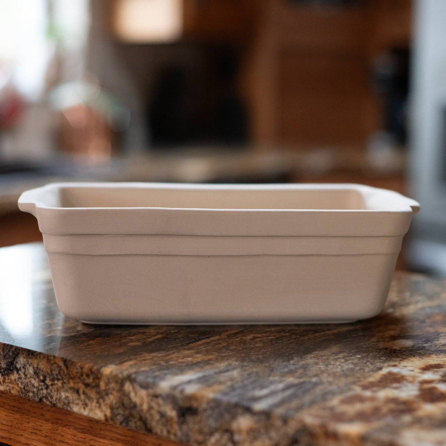 Light beige natural stoneware loaf pan featuring a sturdy, handcrafted design made in the USA, perfect for Kitchen & Food, Cookware, Pots and Pans, Best Sellers, and Bread Making Supplies collections.