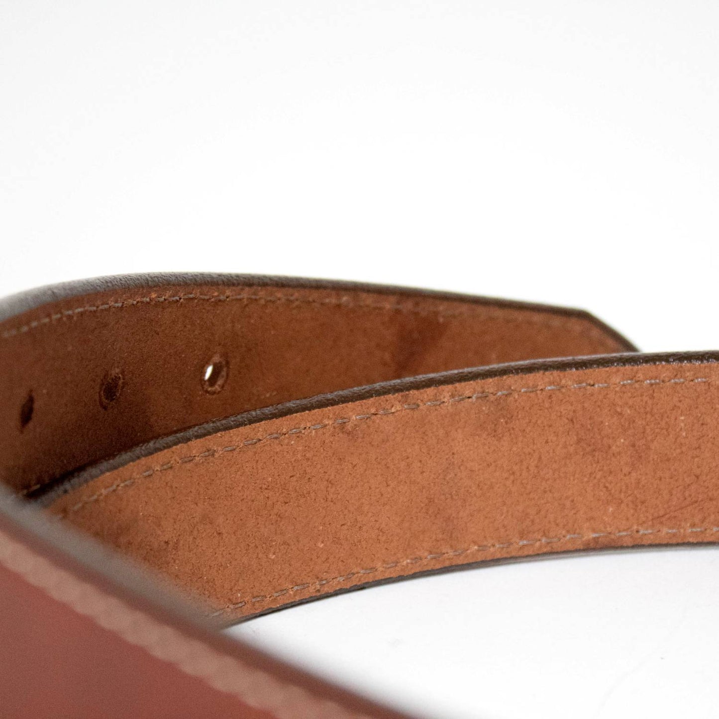 Close-up of a handcrafted Amish-made genuine leather dress belt in rich brown with fine stitching, part of Clothing and Accessories, USA Made, Amish Made collections.