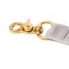 Brass snap hook attached to a beige woven strap, handcrafted and Amish made, ideal for securing clothespin bags in Home & Decor and Clothesline Accessories collections.