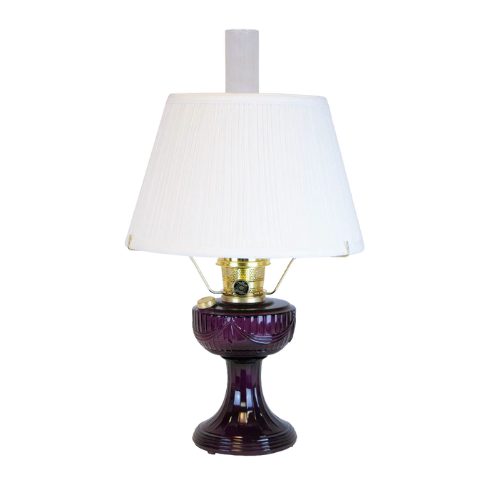 Handcrafted amethyst oil lamp with classic Lincoln drape design, brass fittings, and a 14-inch white pleated cloth shade, featured in Lamps & Lighting and Best Sellers collections.
