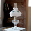 Classic oil lamp with clear glass base and white glass shade featuring painted tropical beach scenes; fits standard 10-inch shade rings, perfect for lamps and lighting collections.