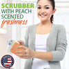 Smiling woman holding a peach-scented silicone dish scrubber, promoting odor-resistant cleaning tools featured in Home & Decor, Household Cleaning, and USA Made collections.