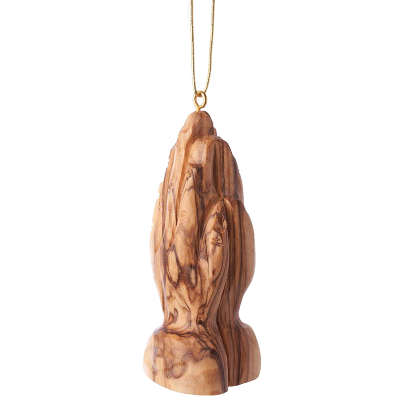 Handcrafted olive wood ornament featuring intricately carved praying hands, designed for holiday decor and home collections with a natural wood grain finish.