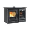 Black enameled cast iron wood stove with visible fire through left door and cooking oven with food and thermometer on right, part of Stoves and Cookstoves collections.