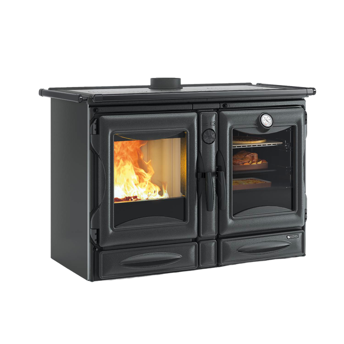 Black enameled cast iron wood stove with visible fire through left door and cooking oven with food and thermometer on right, part of Stoves and Cookstoves collections.