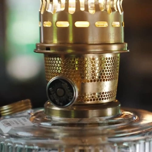 Close-up of the vintage-style brass burner and control knob on a handcrafted cobalt glass oil lamp, ideal for Lamps & Lighting, Oil Lamps, Table Lamps, Best Sellers, and Promo Eligible collections.