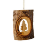 Handcrafted olive wood ornament featuring a natural bark slice with a carved Christmas tree silhouette, perfect for holiday decor and home accents.