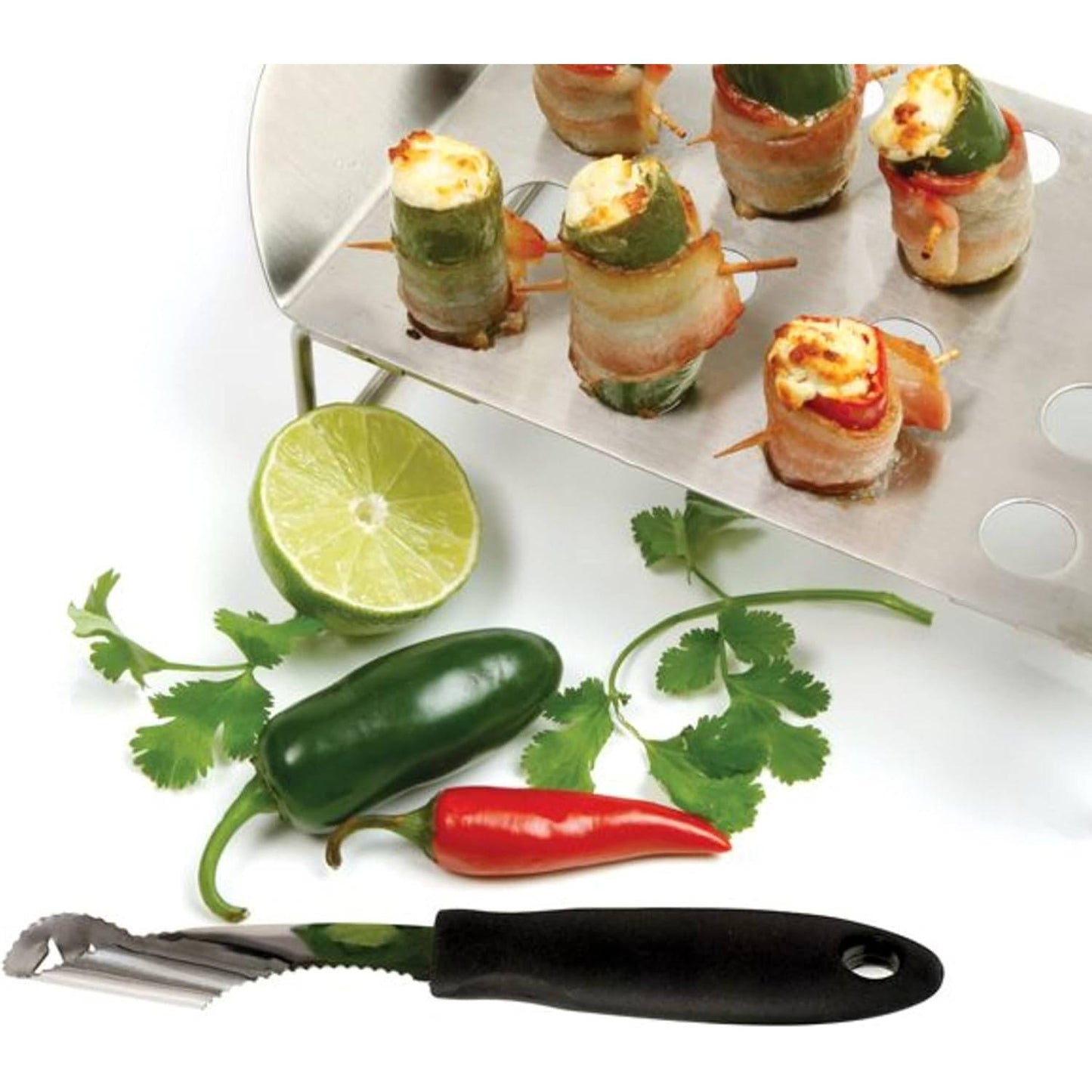 Black-handled corer tool with serrated edge placed beside fresh jalapeno, red chili, lime half, and cilantro leaves, alongside bacon-wrapped stuffed jalapeno appetizers on metal tray, featured in Farm, Garden & Tool, Kitchen & Food, Knives & Axes, Food Prep, and Kitchen Gadgets collections.