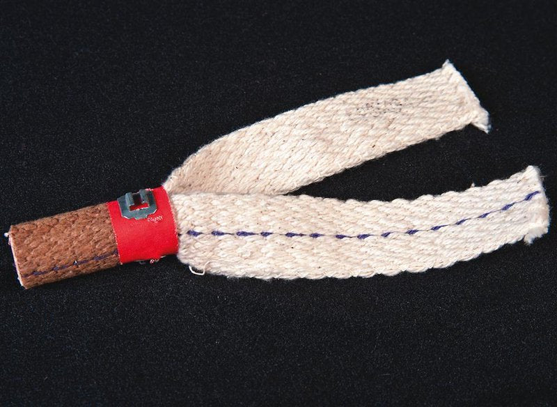 Close-up of a woven wick with a red metal collar, handcrafted for gas burners, ideal for appliances, refrigerators and freezers, best sellers, and all stoves collections.