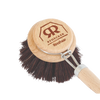 Close-up of a reusable dish brush head with untreated beechwood and natural bristles, highlighting eco-friendly design for household cleaning and best seller collections.