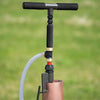 Slim hand pump with foam grip handles attached to well casing, designed for quick water access during power outages, featured in farm, garden, and emergency supply collections.