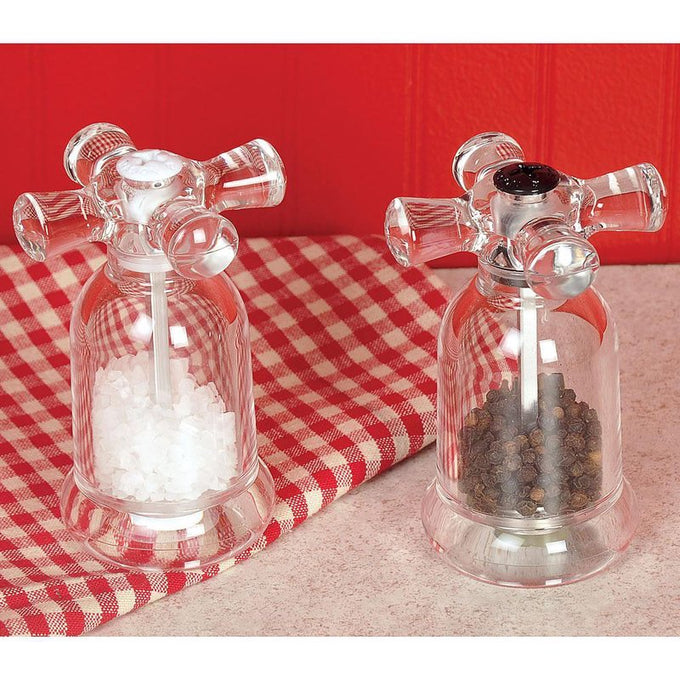 Pair of clear acrylic salt and pepper mills styled like vintage faucet handles, filled with coarse sea salt and black peppercorns, featured in Kitchen & Food, Dinnerware, Storage and Serving, Best Sellers, and Promo Eligible collections.