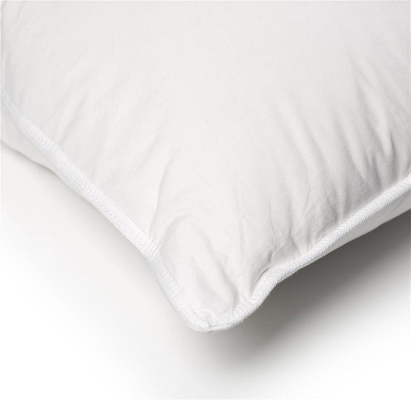 Close-up of a handcrafted white pillow corner with a smooth cotton cover, filled with a supportive core and soft down layers, ideal for Home & Decor, Home Textiles, and Best Sellers collections.