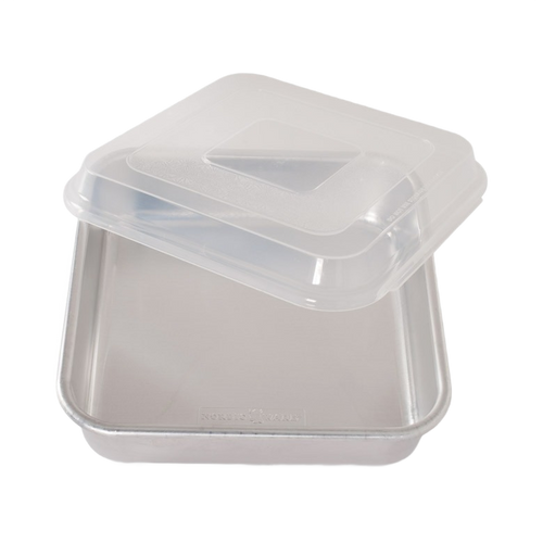 Square aluminum cake pan with encapsulated galvanized steel rims to prevent warping and a clear plastic lid for convenient storage, ideal for baking in Kitchen & Food collections.