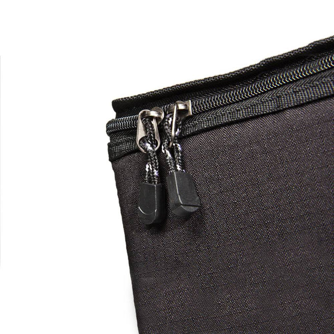 Close-up of a sturdy black ripstop fiber zippered bag with reinforced padded walls, designed for secure storage and transport of lamps and reflectors, ideal for camping and outdoor use.
