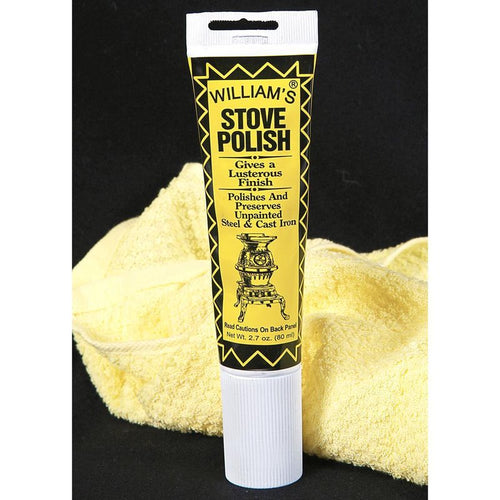 Tube of black satin semi-paste stove polish designed to polish and preserve unpainted steel and cast iron, displayed with a soft yellow cleaning cloth in home and decor setting.