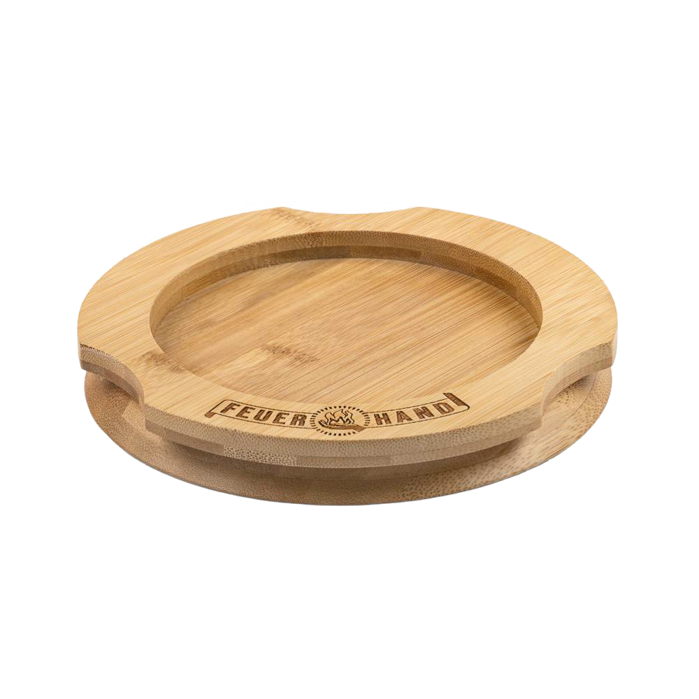 Handcrafted bamboo coaster with engraved Feuerhand logo, designed to protect surfaces from oil residues, ideal for lamps and outdoor use, featured in Camping, Emergency Supplies, and Best Sellers collections.