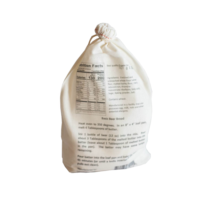Soft fabric drawstring bag containing handcrafted bread mix with nutritional facts and baking instructions, perfect for Kitchen & Food, Pantry, Dry Goods and Mixes, Best Sellers, and Promo Eligible collections.