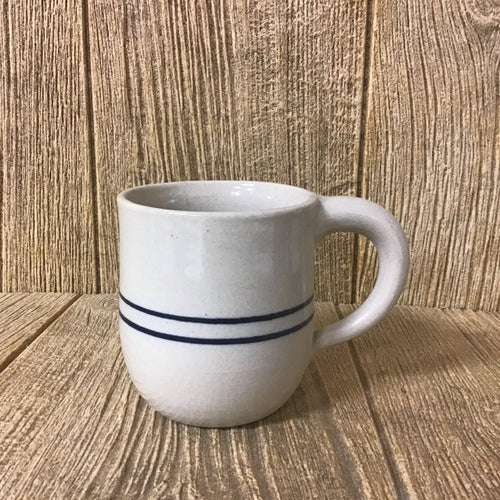 Handcrafted stoneware mug with a round shape and blue stripe design, made in the USA, ideal for coffee or tea, featured in Kitchen & Food and Brewing Coffee and Tea collections.