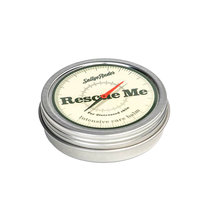 Small round metal tin with screw-on lid featuring vintage compass design and text indicating an all-natural intensive care balm made in the USA, part of Health & Wellness and Best Sellers collections.