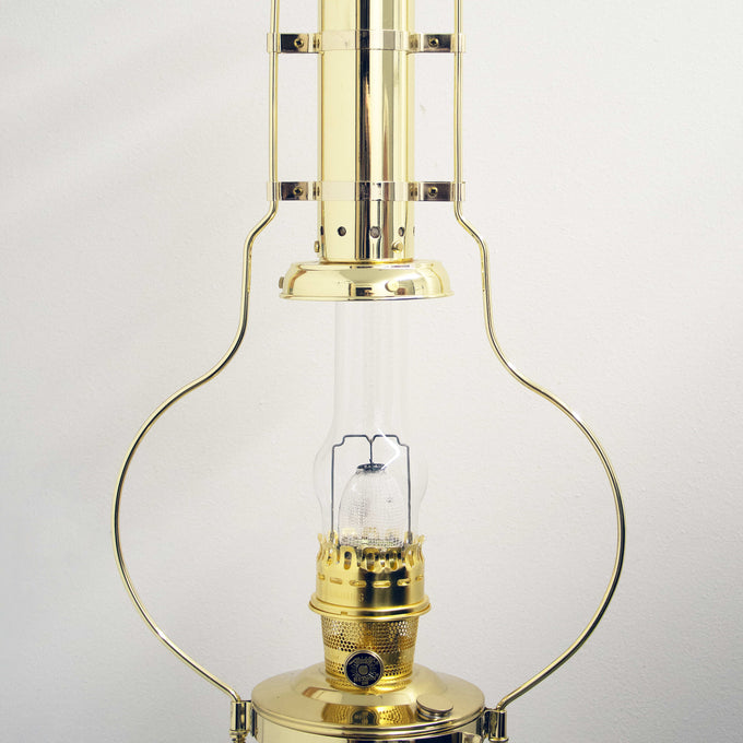 Handcrafted brass hanging oil lamp with clear glass chimney and solid brass frame, designed to provide bright, reliable light, featured in Farm, Garden & Tool and Emergency Supplies collections.