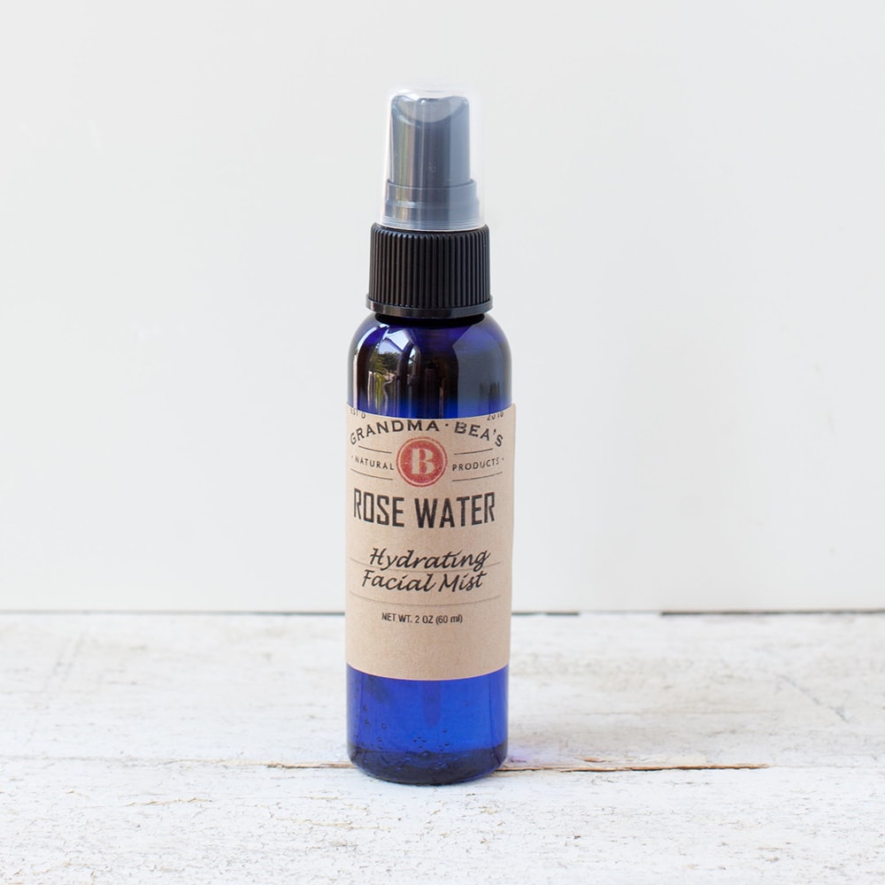 Handcrafted hydrating facial mist in a blue glass bottle with spray top, featuring rose water for natural skin refreshment, from Health & Wellness, Grooming and Personal Hygiene, USA Made, Best Sellers, and Promo Eligible collections.