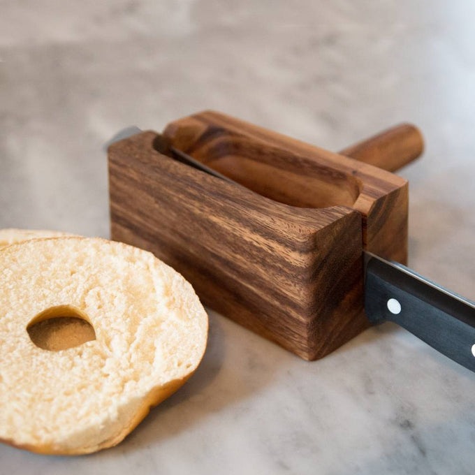 Handcrafted acacia hardwood bagel miter with wide base for stable slicing, featuring knife slots for straight cuts, ideal for Kitchen & Food, Food Prep, and Bread Making Supplies collections.