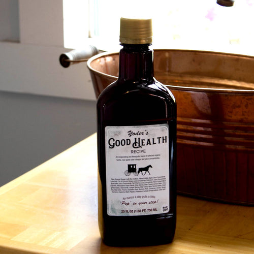 Dark brown glass bottle of handcrafted Yoder's Good Health Recipe tonic featuring raw apple cider vinegar and organic herbs, made in USA, shown in a kitchen setting for Health & Wellness and Best Sellers collections.
